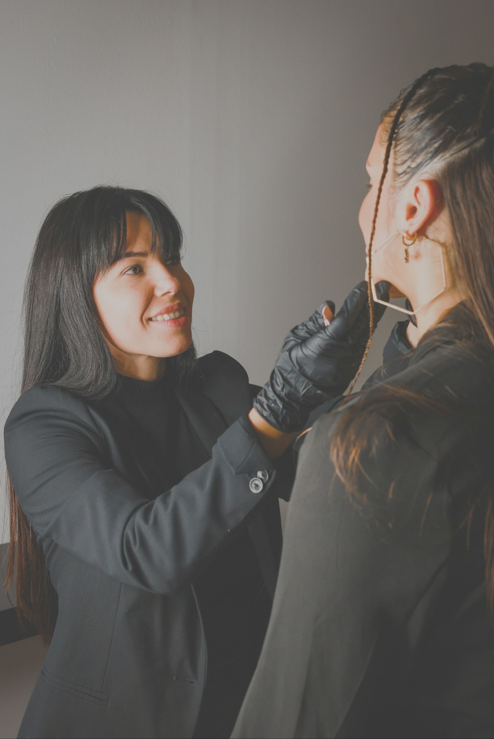 Stylist consulting with a client about her hair